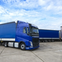 truck-vehicle-with-trailers-in-background.jpg